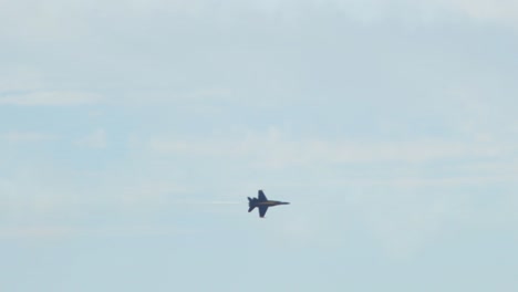 Blue-Angel-FA---18A-Fighter-Jet-Flys-Through-Trail-and-Clouds