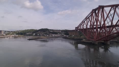 Forth-Rail-Bridge-at-track-level,-flying-in-a-forward-motion-from-South-to-North,-looking-towards-North-Queensferry-and-Fife