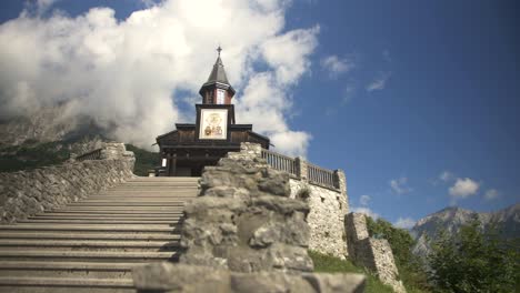 Right-wide-slider-shot-of-church-of-holy-spirit-from-1st-world-war-in-Javorca,-Tolmin,-Slovenia