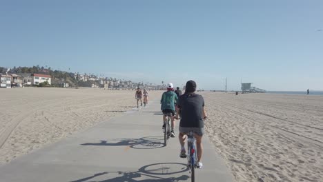 Follow-Shot-of-Cyclists-riding-along-bike-path