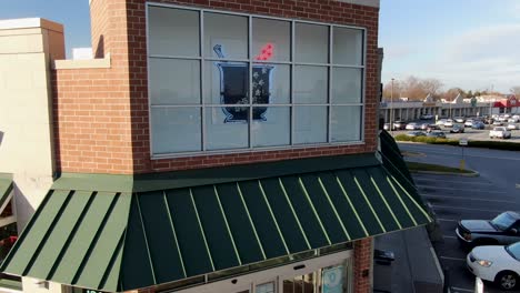 Rising-aerial-reveals-Walgreen's-Pharmacy-logo-at-retail-store-location-in-Pennsylvania