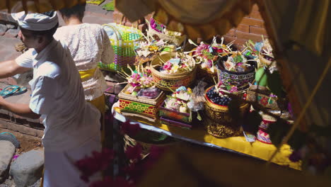 Balinese-man-and-woman-perform-the-ceremony-for-the-lunar-moon-celebration