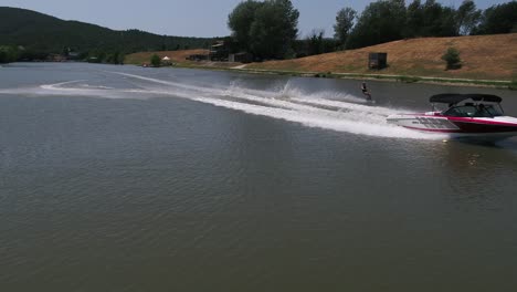 Aerial-action-front-tracking-of-speedboat-and-water-ski