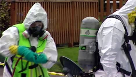 HAZMAT-CREW-MEMBER-CLEANING-CONTAMINATED-PERSON-SUIT