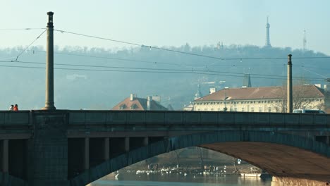 Misty-morning-by-the-Vltava-river-and-Prague-Castle-with-foggy-weather-empty-bridge-calm-quiet