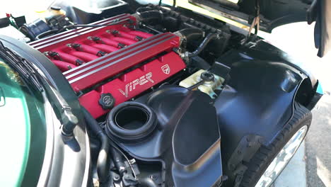 Under-hood-of-black-Dodge-Viper-GTS-V10-engine,-reveal