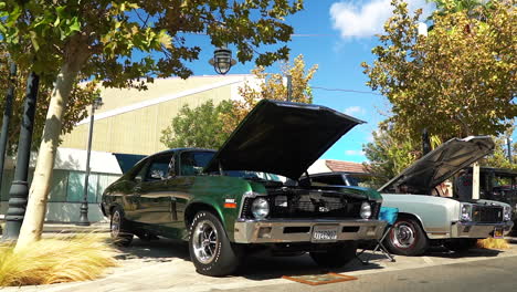 Beautiful-green-Chevy-Camaro-SS-on-display-with-hood-propped,-slow-motion