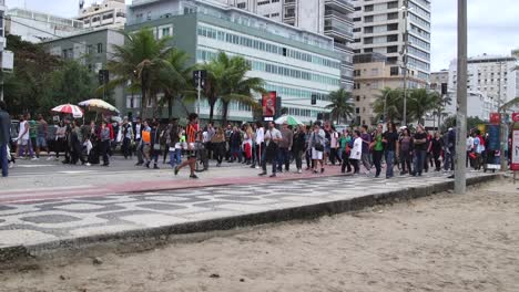 People-demonstrating-in-the-streets-during-a-street-protest-for-the-protection-of-the-Amazon-forest-in-Rio-de-Janeiro,-Brazil