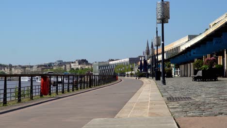 Quai-des-Marques-store-complex-near-the-Garonne-river-empty-due-to-the-COVID-19-pandemic,-Stable-handheld-shot