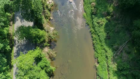 An-aerial-view-of-a-stream-and-a-road-in-the-mid-summer-days