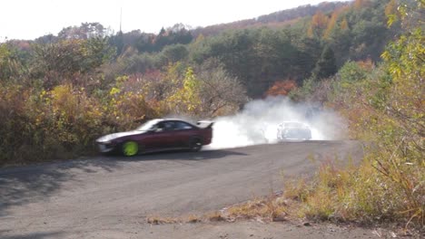 Two-Nissan-Silvia-Cars-Drifting-at-High-Speeds-Around-Hairpin-Corners