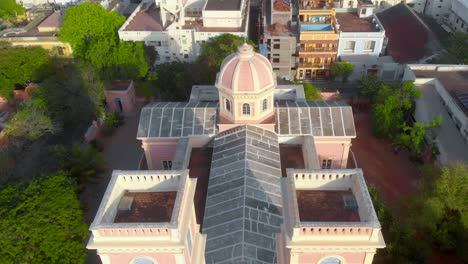 Top-angle-Aerial-Reveal-shot-of-Our-Lady-Angeles-Church-on-an-early-morning-near-the-french-town,-Puducherry-shot-with-a-drone-in-4k