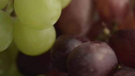Bunch-of-green-and-red-grapes-rotating-macro-shot
