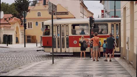 Tram-passing-by-in-slow-motion-in-Prague-historic-city-center,-Czech-Republic,-Europe