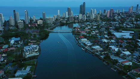 Flying-over-Main-canal-at-Sunrise-Gold-Coast,-blue-hour-Surfers-Paradise