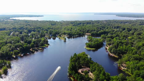 Aerial-daytime-footage-over-beautiful-lakes-in-Michigan,-USA-during-summer