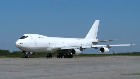 Boeing-Jumbo-Jet-Freighter-Aircraft-Taxiing-Out-Frame,-Sunny-Day