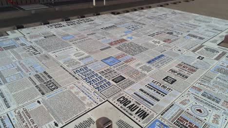 Blackpool-comedy-carpet-comedian-jokes-promenade-floor-aerial-view-low-tilt-up-to-street-view