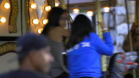 El-Dorado-County-Fair-California,-Close-up-of-the-Carousel-with-riders-enjoying-a-day-out