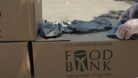 Woman-Folding-Masks-at-LA-Food-Bank-During-Covid-19-Coronavirus-Pandemic