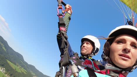 Portrait-of-paragliders-in-tandem-during-flight,-Slovenia