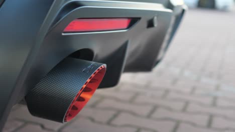Close-Up-of-Exhaust-Pipes-on-Luxury-Sports-Car,-Detail-Slow-Motion