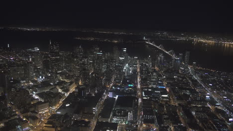 Vista-Aérea-De-La-Ciudad-Y-Edificios-Altos-En-La-Noche