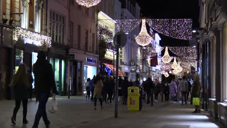 Still-shot-of-a-Dublin-street-at-Chrismas-time-in-hard-times-with-some-people-on-a-not-so-busy-street
