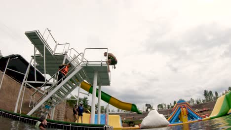 Man-Does-A-Double-Backflip-On-A-Platform-At-Grand-Canyon-Water-Park-In-Chiang-Mai-Thailand---tilt-down-shot