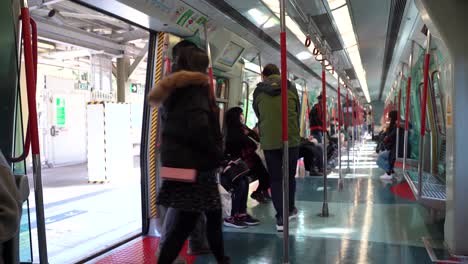 People-entering-MTR-train-in-Asia-Hong-Kong-during-Coronavirus-COVID-Pandemic