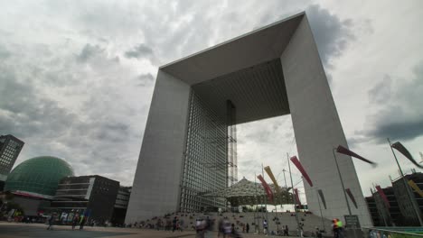 Timelapse-of-the-Grande-Arche-de-la-défense-near-Paris-in-Puteaux-during-overcast-day