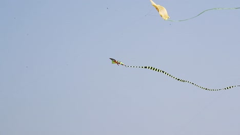 A-red-kite-flying-against-a-blue-sky