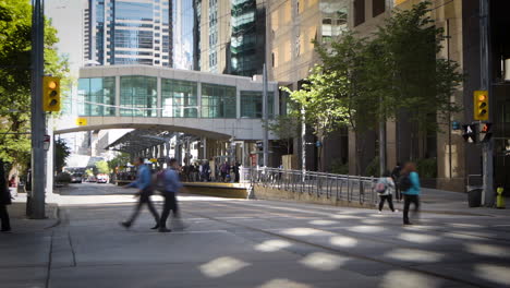 Time-lapse-of-streetcars-and-traffic-driving-on-a-city-street-downtown