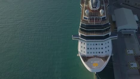 Aerial-close-up-view-of-the-bow-on-the-cruise-ship-a-still-and-pan-shot-with-movement-in-the-water