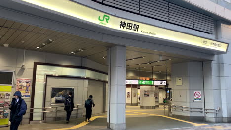 The-facade-of-Kanda-Station-South-gate-with-people-walking-around