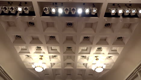 Chandelier-and-chairs-at-Oji-Hall,-Ginza,-Tokyo,-Japan,-2018