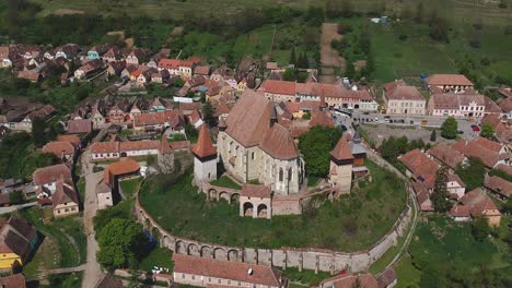 Drone-Aerial-of-Lutheran-Evangelical-Fortified-Church-Unesco-World-Heritage-and-Cityscape-and-Landscape-of-Biertan-Commune-in-Central-Romania-Europe