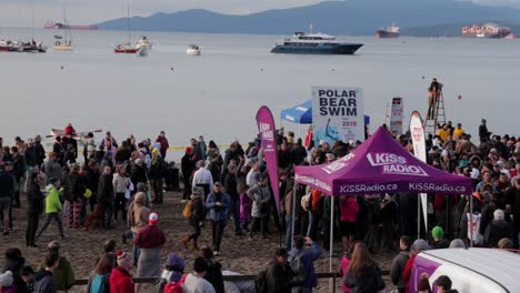 Various-drone-shots-at-English-Bay-near-downtown-Vancouver,-BC-during-Polar-Bear-2019-event