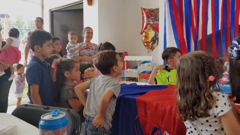 Really-anxious-kids-waiting-for-the-cake-of-the-birthday-party-to-be-distributed