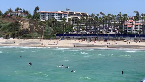 A-Pacific-Surfliner-train-passing-through-the-beautiful-coastlines-of-San-Clemente-beach-pier-in-Southern-California