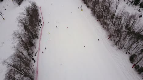 Aerial-footage-taken-from-a-drone-of-people-skiing-on-Burke-Mountain-in-Northern-Vermont