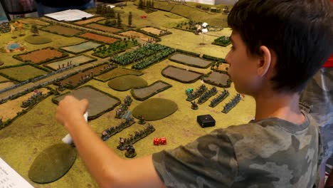 Adults-teach-young-people-how-to-play-tactical-civil-war-gaming