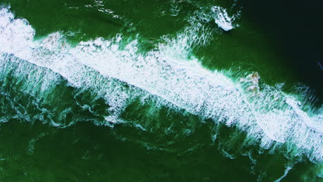 Aerial-descending-from-400-feet-over-ocean-wave-patterns-and-textures
