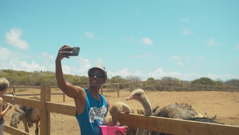 Amazing-footage-of-a-person-feeding-an-Ostrich-before-he-bites-his-hat