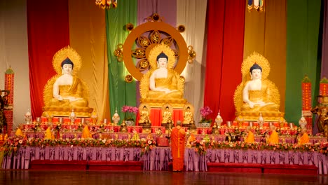 monks-praying-in-front-of-buddha-statue-in-buddha-birthday-festival-people-and-monks-praying-buddhism-religion