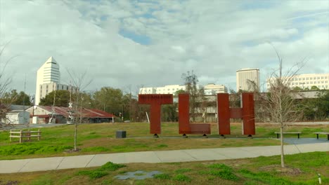 Aerial-View-of-TLH-Statue-With-Buildings-in-Background-in-Tallahassee,-Florida-USA