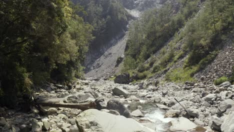 Stream-Flowing-Between-The-Rocks-In-Lisong-Hot-Spring-In-Taiwan---Medium-Shot