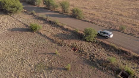 aerial-editorial-following-a-suv-on-a-gravel-road