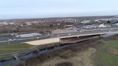 Aerial-view-of-traffic-vehicles-on-Mersey-gateway-motorway-transportation-bridge-exit