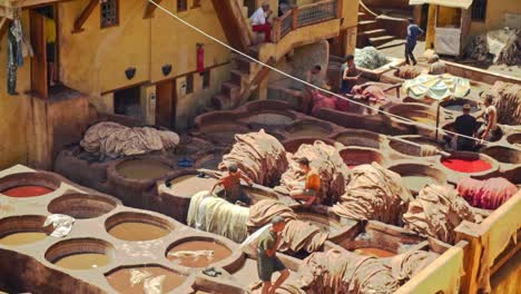 Workers-at-he-Chouara-Tannery-in-Fez-soften-hides-and-dye-materials-using-tradtional-techniques